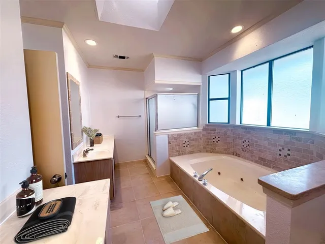 a bathroom with a bathtub and a sink