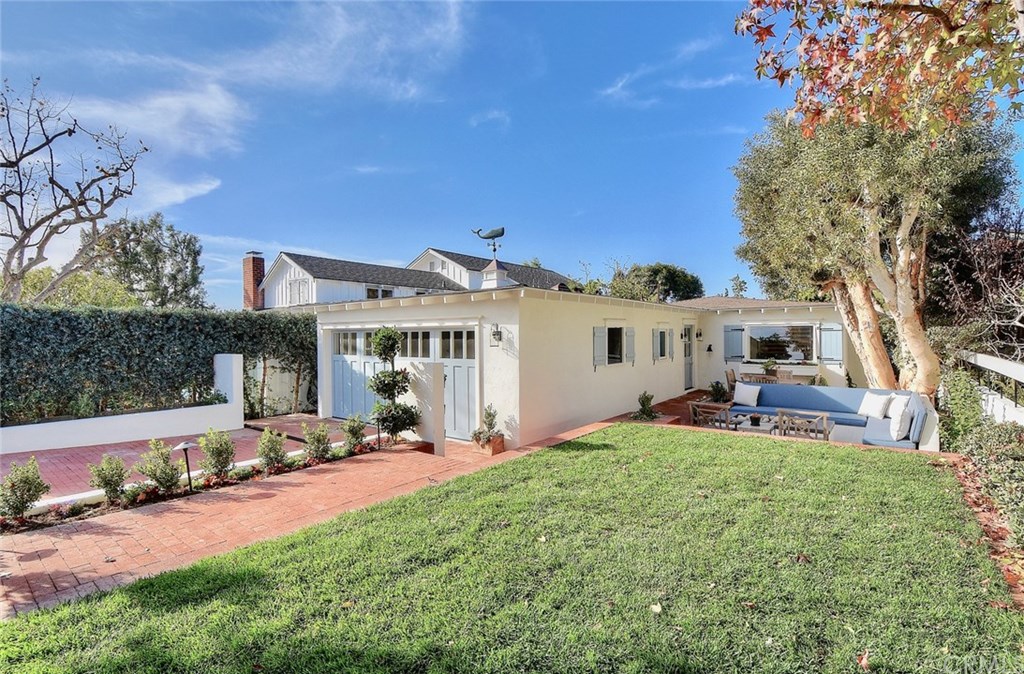 Welcome to this beautifully reimagined contemporary beach cottage located on the Village's Oak Street, arguably the best street in Laguna.