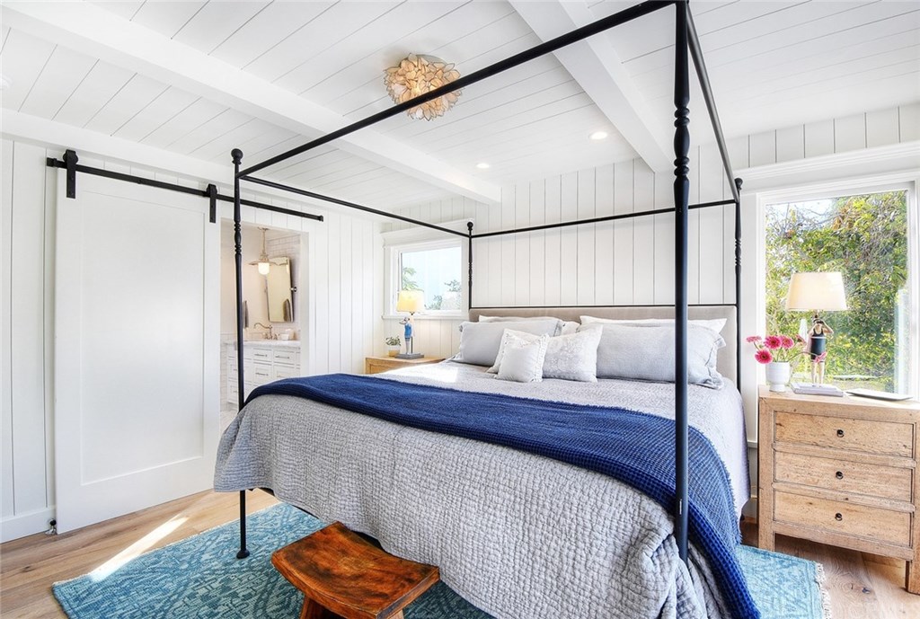 564 Oak Street Laguna Beach, CA 92651 - Photo 16 of 34 Another view of the master suite with barn door leading to the master bath.