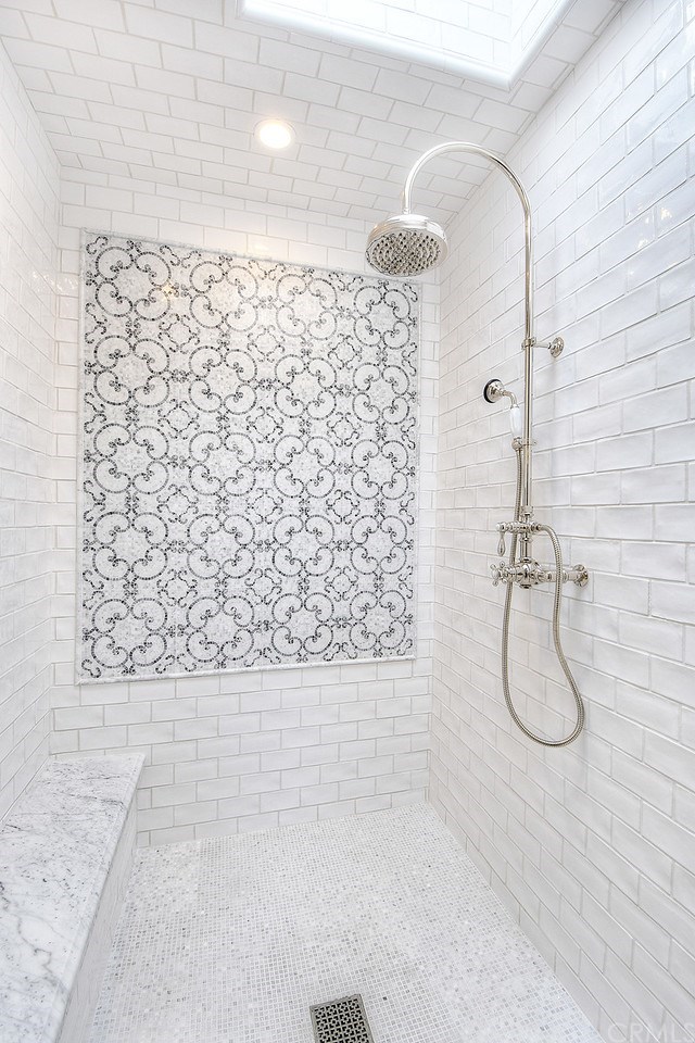 564 Oak Street Laguna Beach, CA 92651 - Photo 18 of 34 Master bath walk-in shower complete with skylight, handmade porcelain tile and Carrara mosaic design, and custom glass shower enclosure