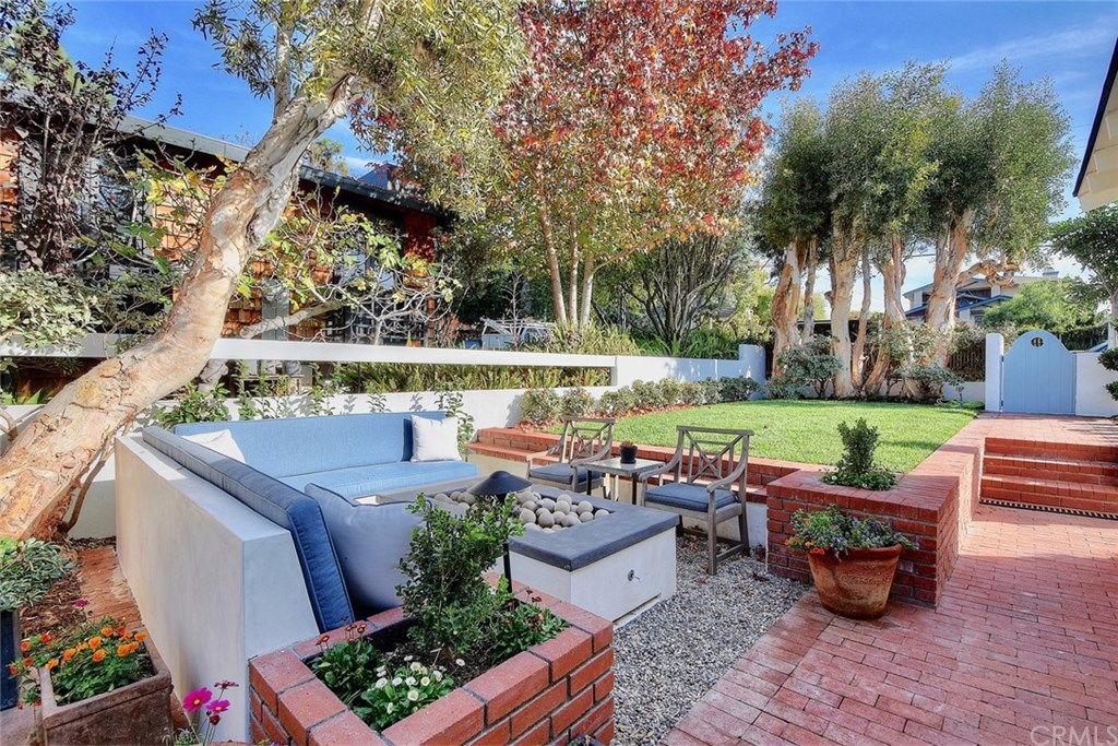 564 Oak Street Laguna Beach, CA 92651 - Photo 3 of 34 Front yard looking towards the street also features brick pavers and expansive grass area with plenty of room to play.