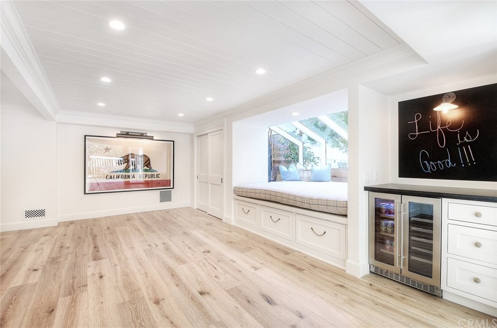 564 Oak Street Laguna Beach, CA 92651 - Photo 24 of 34 Downstairs features beverage fridge, chalk board wall, daybed with custom cushions, and custom closet.