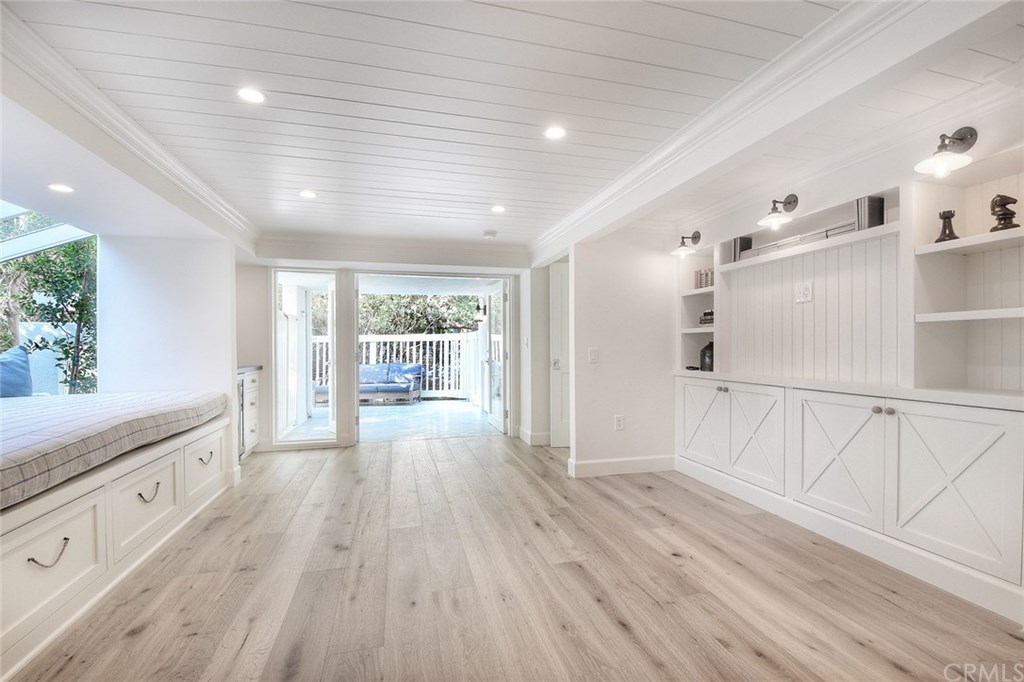 564 Oak Street Laguna Beach, CA 92651 - Photo 25 of 34 Bonus room with built ins and french doors leading to the backyard and jacuzzi.