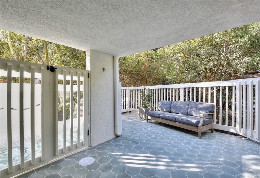 564 Oak Street Laguna Beach, CA 92651 - Photo 28 of 34 Bonus room leads to an expansive deck overlooking the backyard and a jacuzzi through the gate to the left.