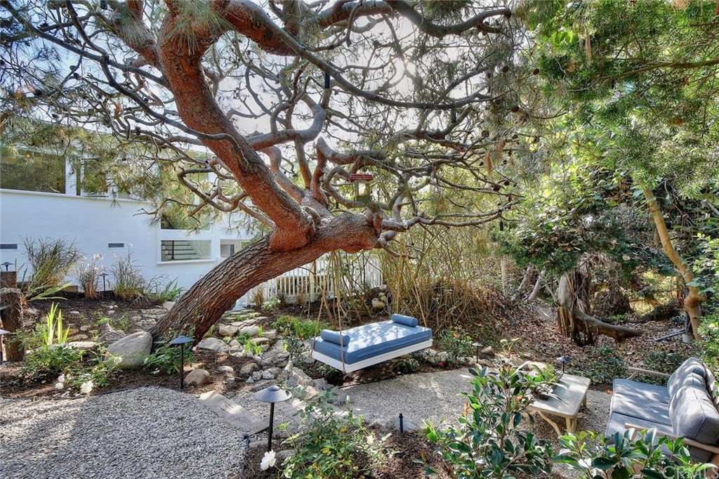 564 Oak Street Laguna Beach, CA 92651 - Photo 30 of 34 A city-maintained natural water course runs through this truly special and tranquil backyard complete with a custom swing bed and mature trees offering plenty of privacy.
