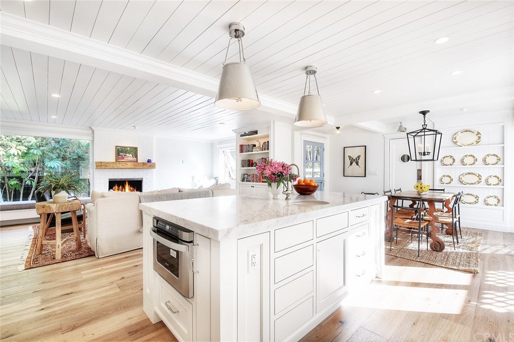 564 Oak Street Laguna Beach, CA 92651 - Photo 8 of 34 Kitchen looking towards the dining room and family room with gorgeous 8" plank white oak hardwood floors throughout.