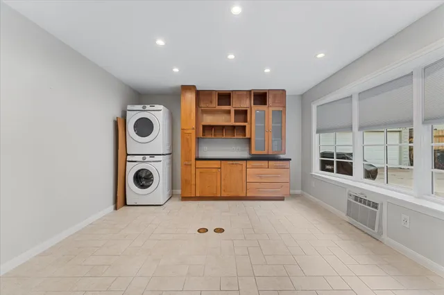 a view of livingroom with walk in closet and wooden floor