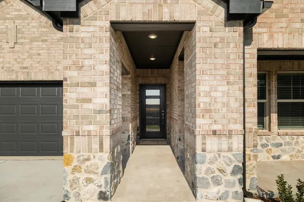 a door view with a brick wall