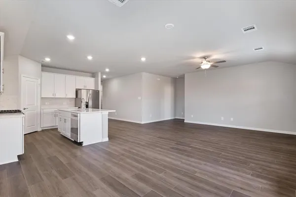 a view of kitchen with cabinets and wooden floor