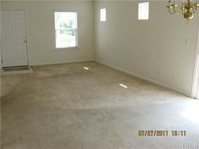 5829 Ricker Road Raleigh, NC 27610 - Photo 3 of 13 Step inside this bright and light living room with plenty of space for entertaining. Living Room