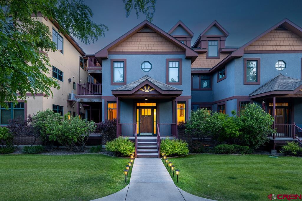 a front view of a house with garden