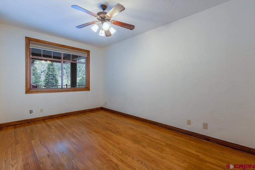 355 East 3rd Avenue, Unit 112 Durango, CO 81301 - Photo 13 of 27 an empty room with a window and a fan