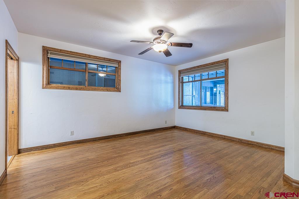 355 East 3rd Avenue, Unit 112 Durango, CO 81301 - Photo 15 of 27 a view of an empty room with wooden floor and a window