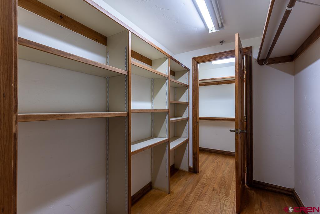 355 East 3rd Avenue, Unit 112 Durango, CO 81301 - Photo 17 of 27 a view of walk in closet with wooden floor