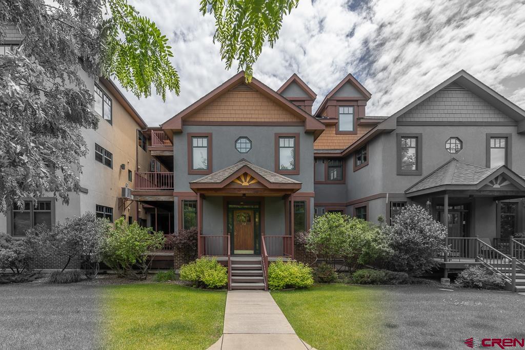 355 East 3rd Avenue, Unit 112 Durango, CO 81301 - Photo 23 of 27 a front view of a house with a yard and potted plants