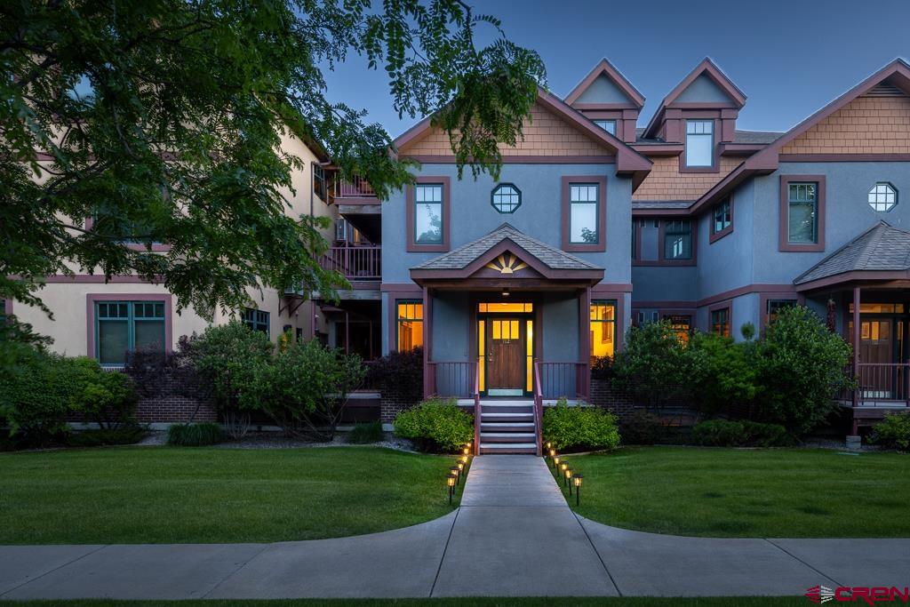 355 East 3rd Avenue, Unit 112 Durango, CO 81301 - Photo 26 of 27 a front view of a house with a yard