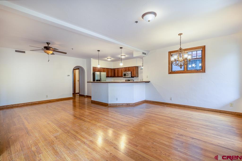 355 East 3rd Avenue, Unit 112 Durango, CO 81301 - Photo 6 of 27 wooden floor in an empty room with a window