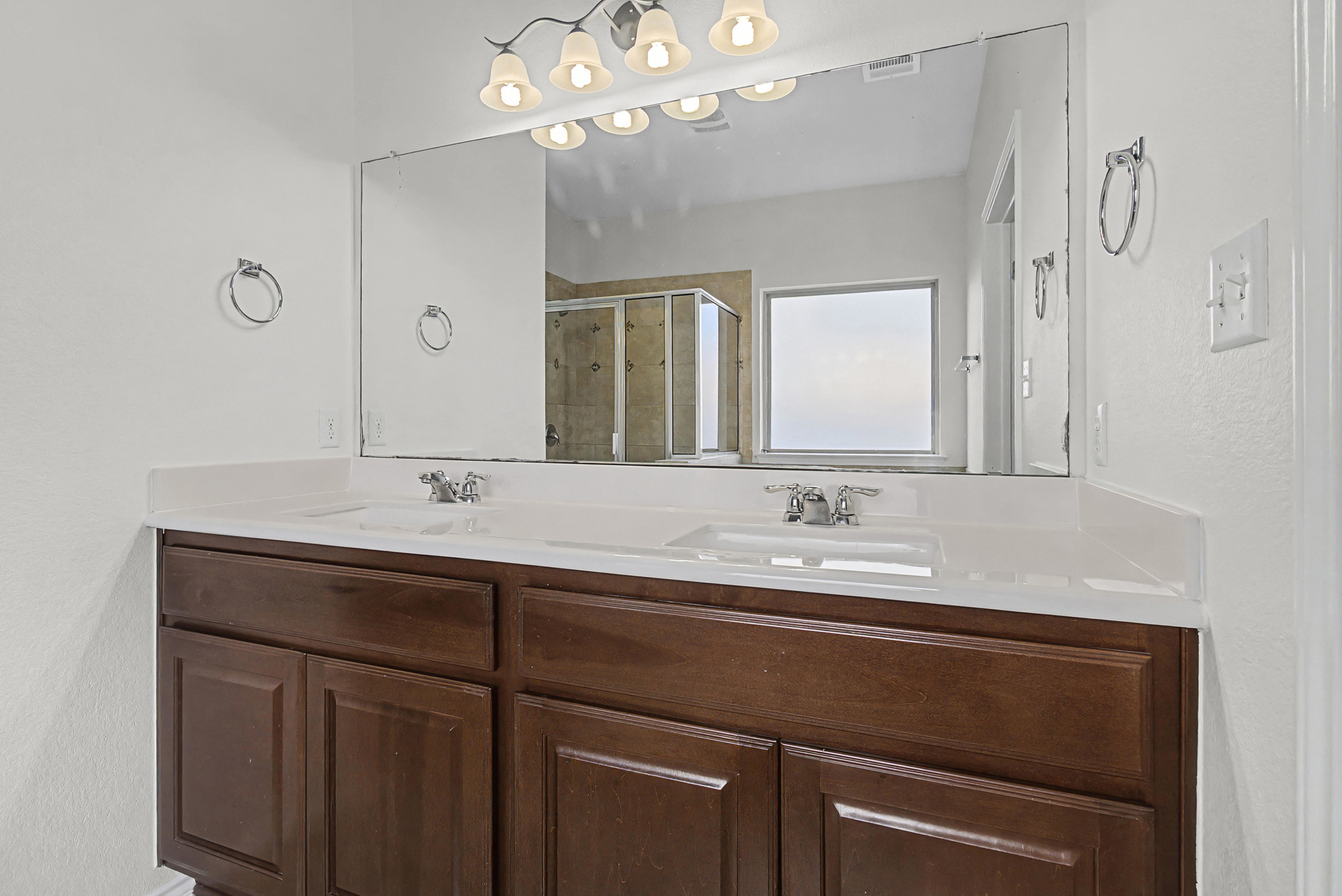 501 Silver Trail Round Rock, TX 78664 - Photo 12 of 22 a bathroom with a sink double vanity and a mirror
