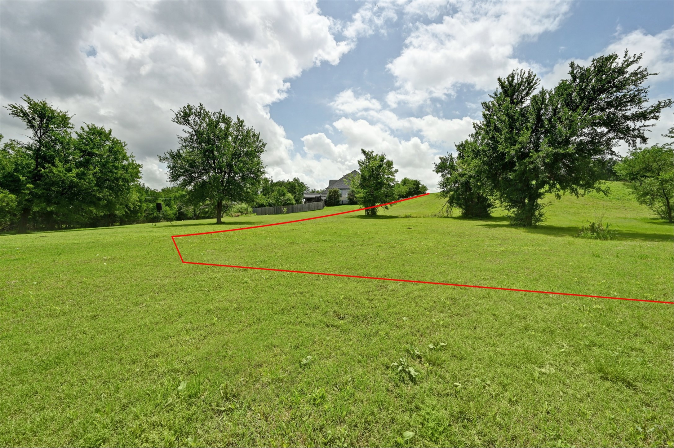1700 Tanner Loop Taylor, TX 76574 - Photo 8 of 32 Expansive green space featuring mature trees and a gently sloping terrain