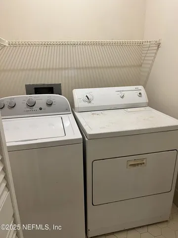 a utility room with dryer and washer
