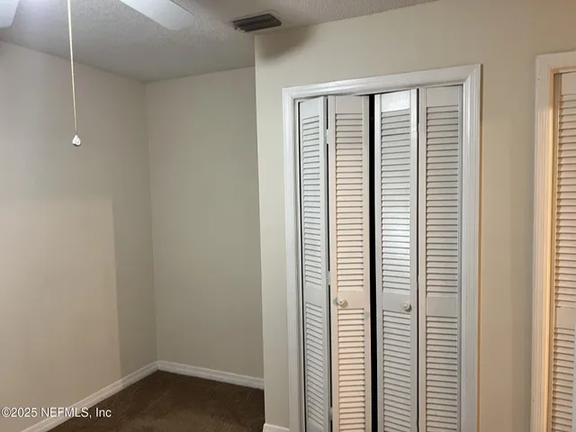 a view of a room that has a window in it