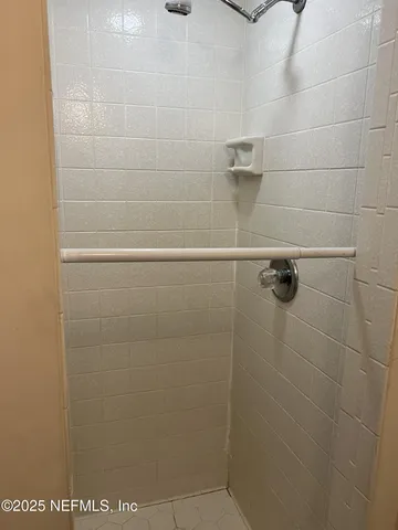 a white toilet sitting next to a window