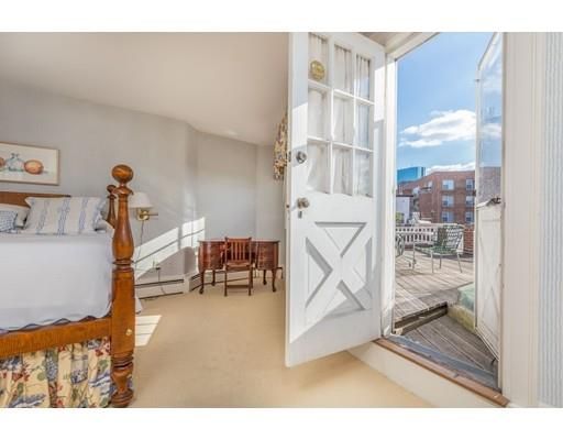 a view of a livingroom with furniture and a floor to ceiling window
