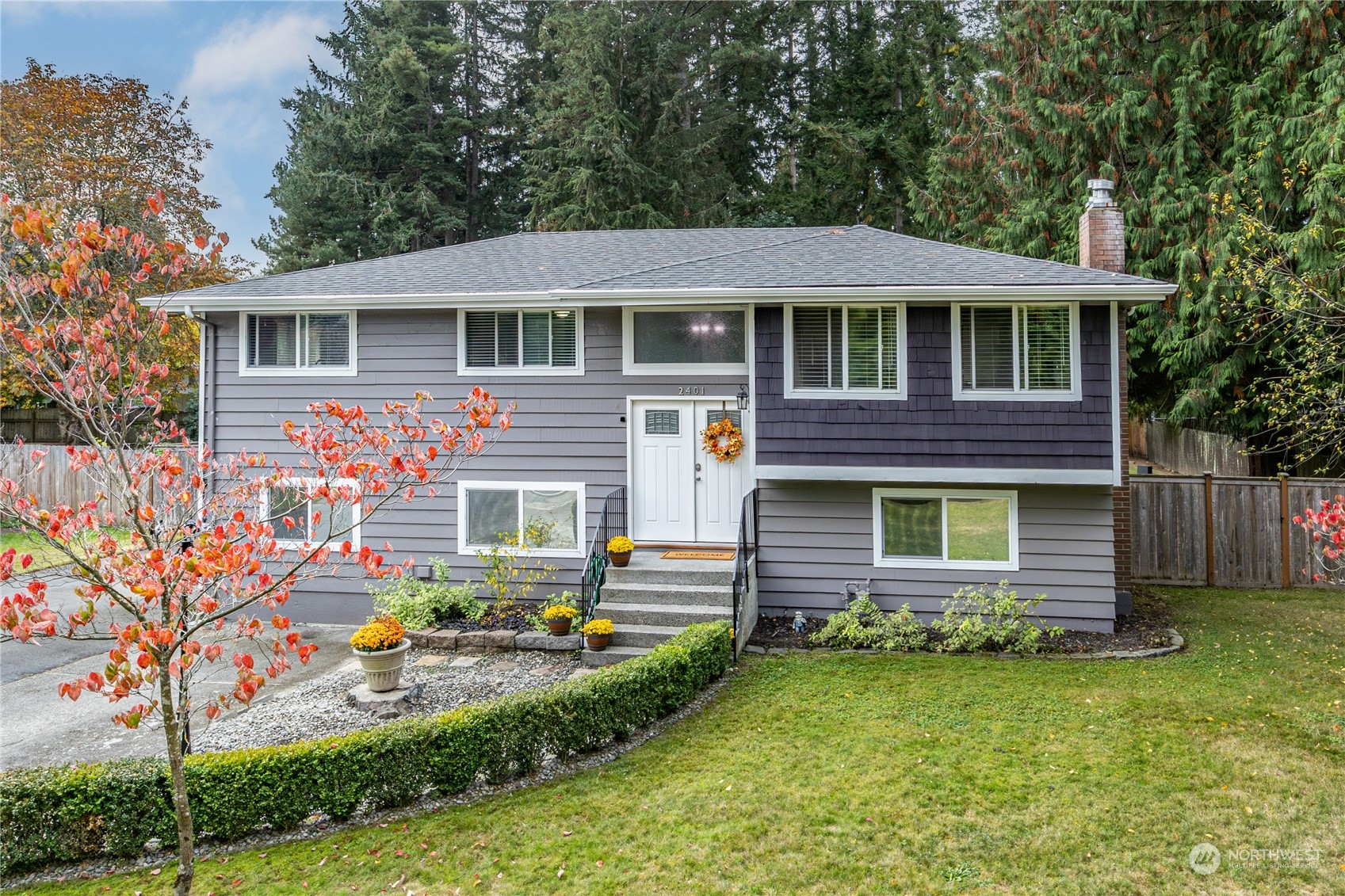 2401 Northeast John Carlson Road Bremerton, WA 98311 - Photo 1 of 36 a front view of a house with garden