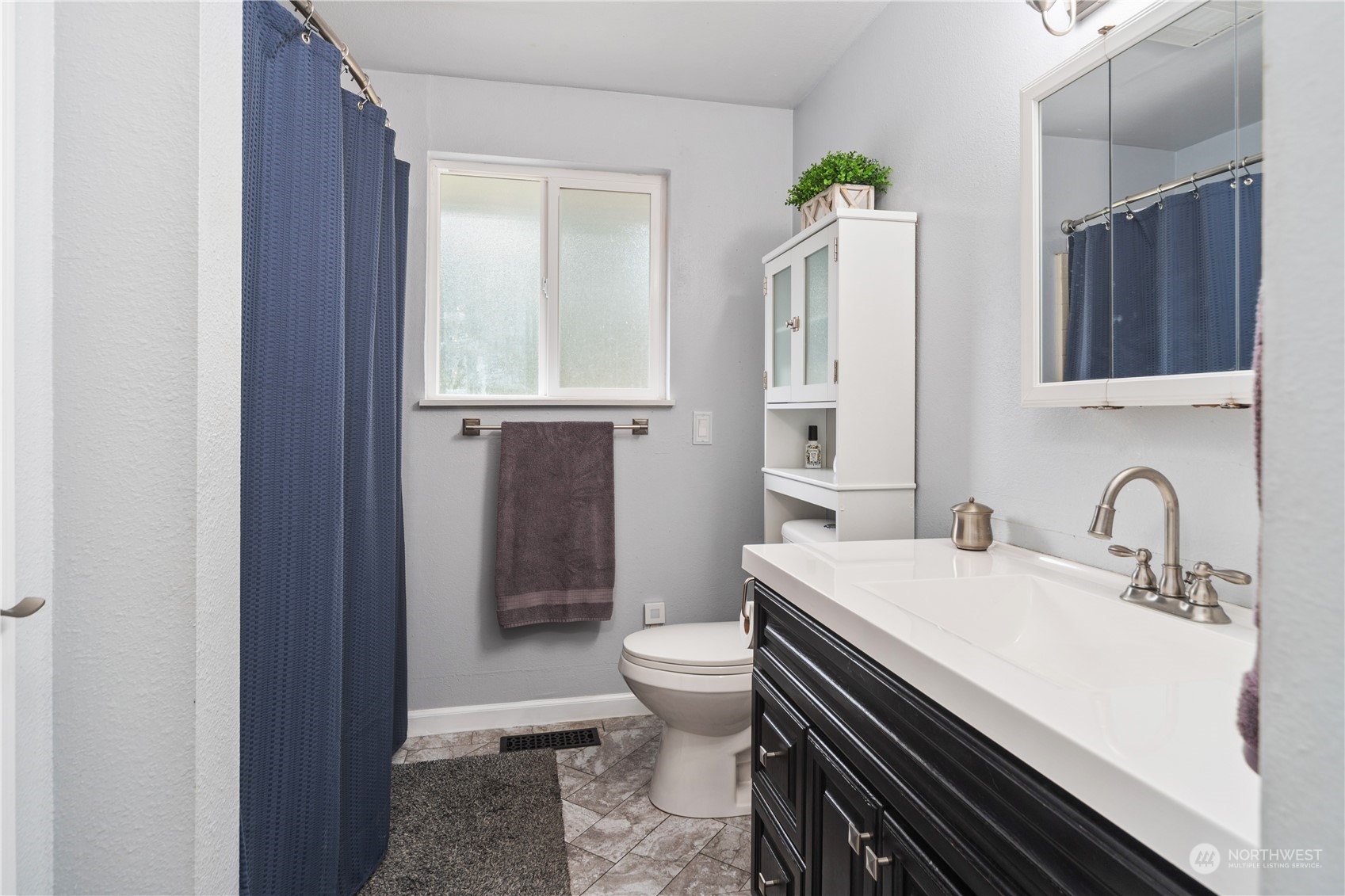2401 Northeast John Carlson Road Bremerton, WA 98311 - Photo 15 of 36 a bathroom with a sink a toilet and shower