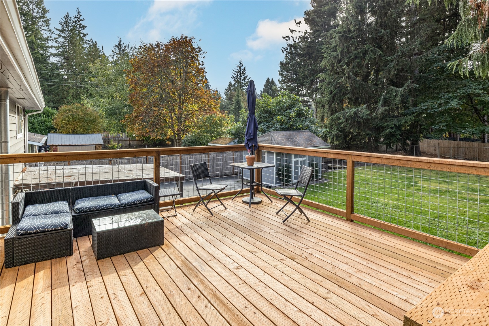 2401 Northeast John Carlson Road Bremerton, WA 98311 - Photo 27 of 36 a view of a balcony with wooden floor and outdoor seating