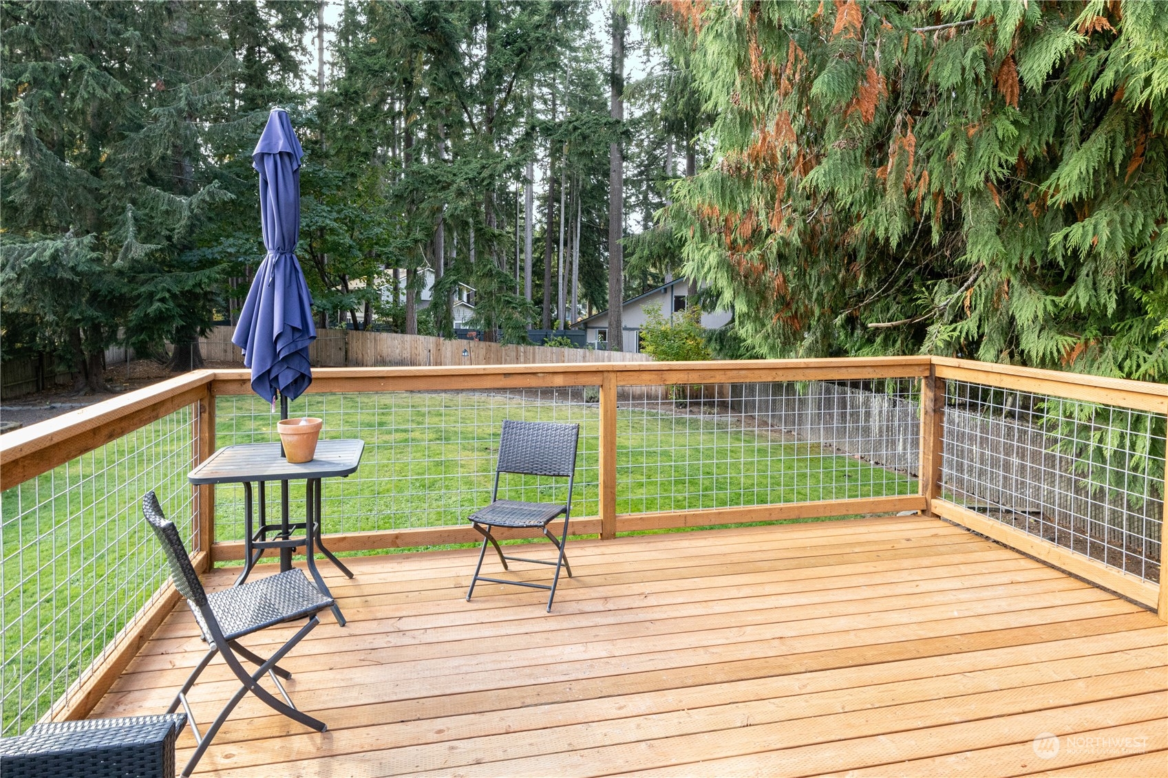 2401 Northeast John Carlson Road Bremerton, WA 98311 - Photo 28 of 36 a view of a deck with wooden floor and outdoor seating