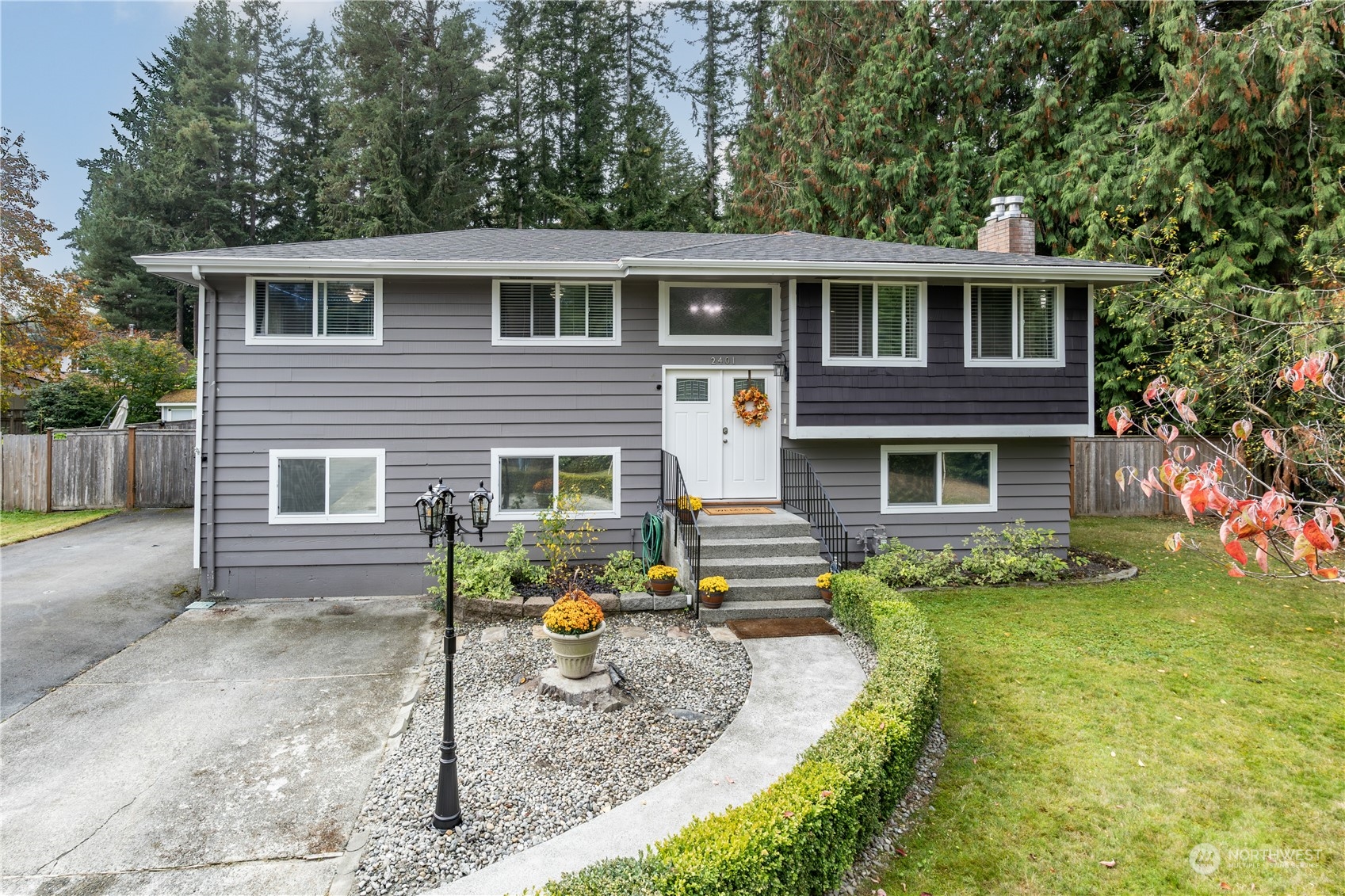 2401 Northeast John Carlson Road Bremerton, WA 98311 - Photo 3 of 36 a front view of house with yard and green space