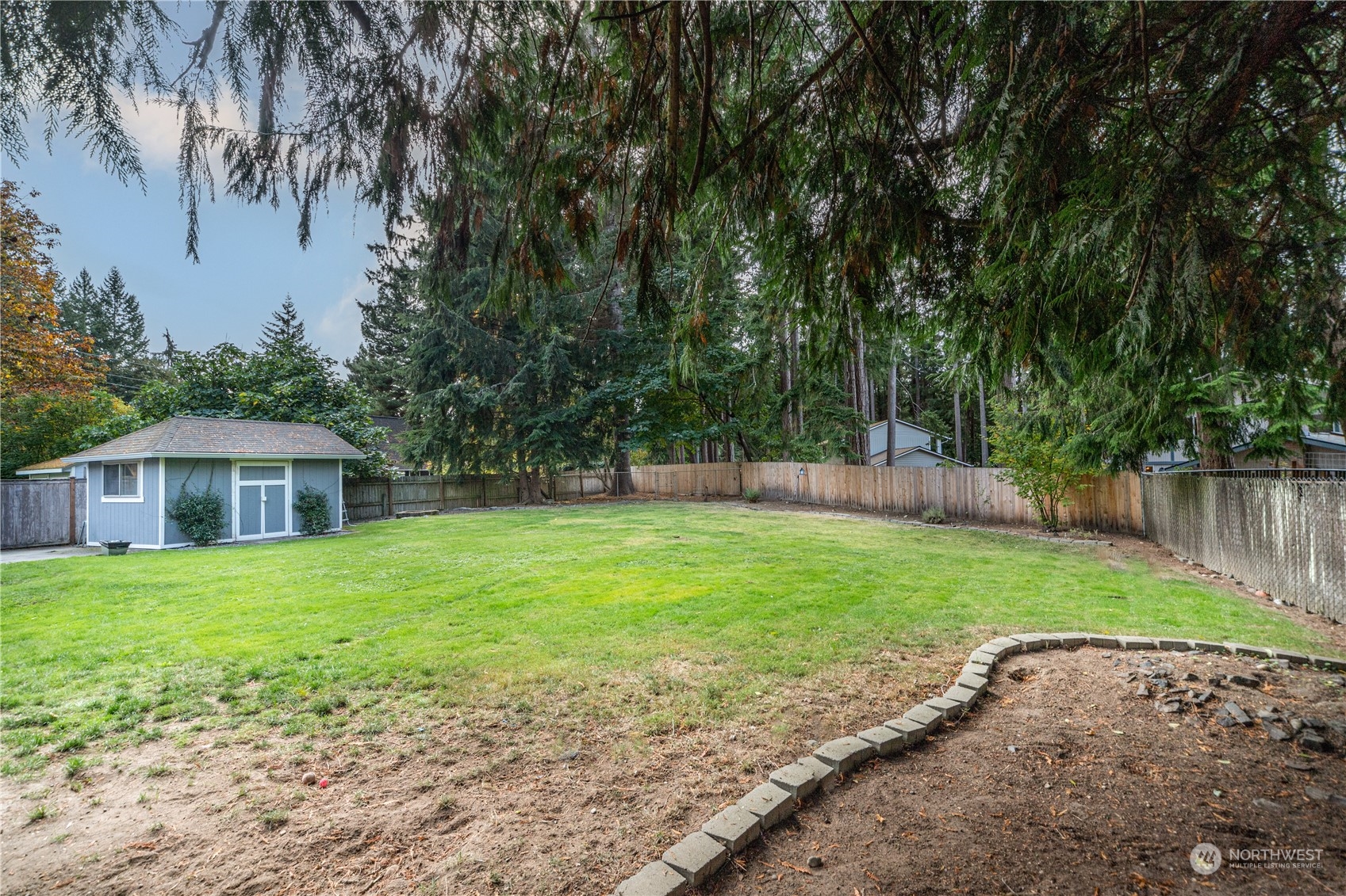 2401 Northeast John Carlson Road Bremerton, WA 98311 - Photo 31 of 36 a view of a house with a backyard