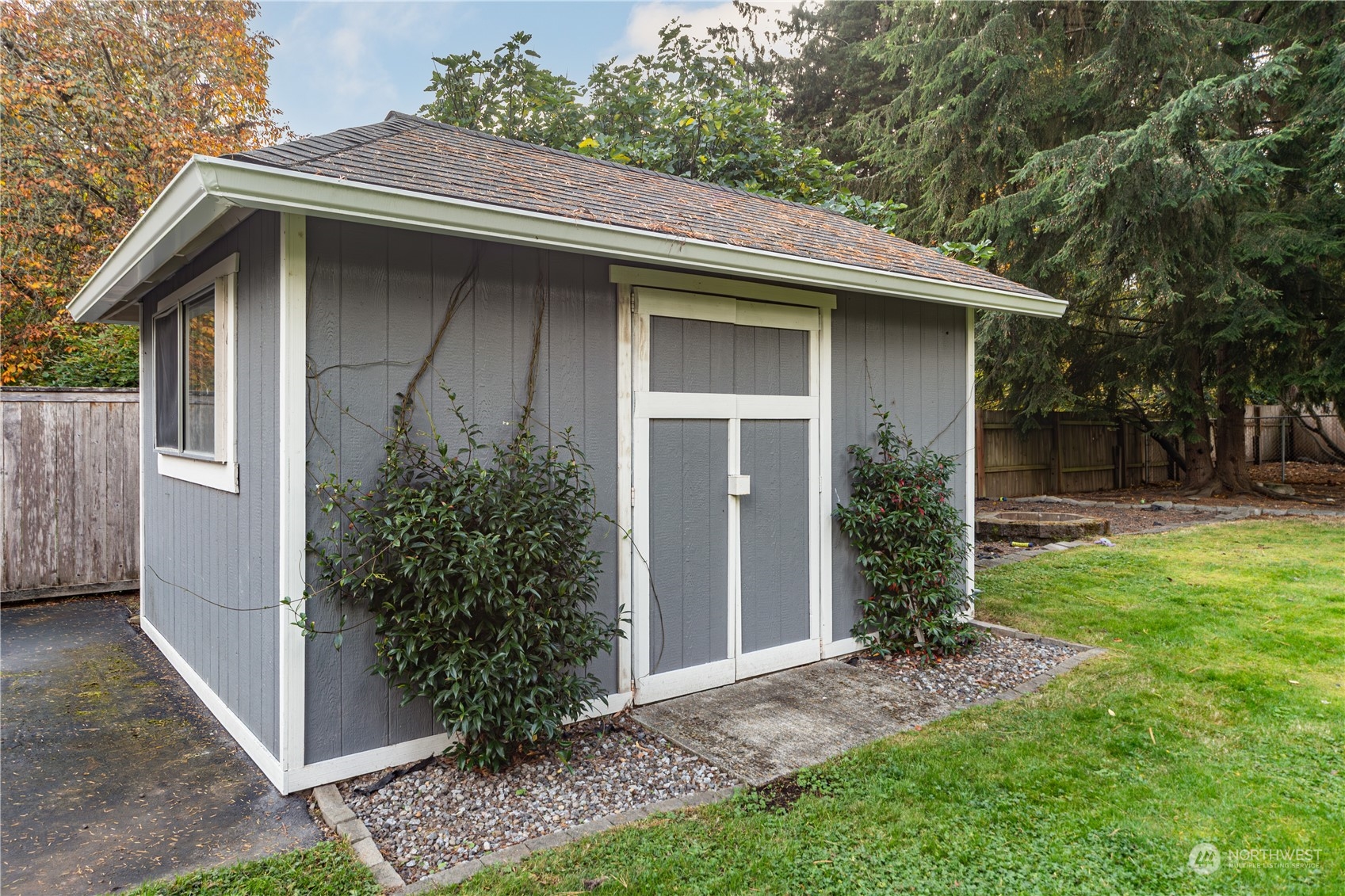 2401 Northeast John Carlson Road Bremerton, WA 98311 - Photo 35 of 36 a view of a wooden house with a small yard