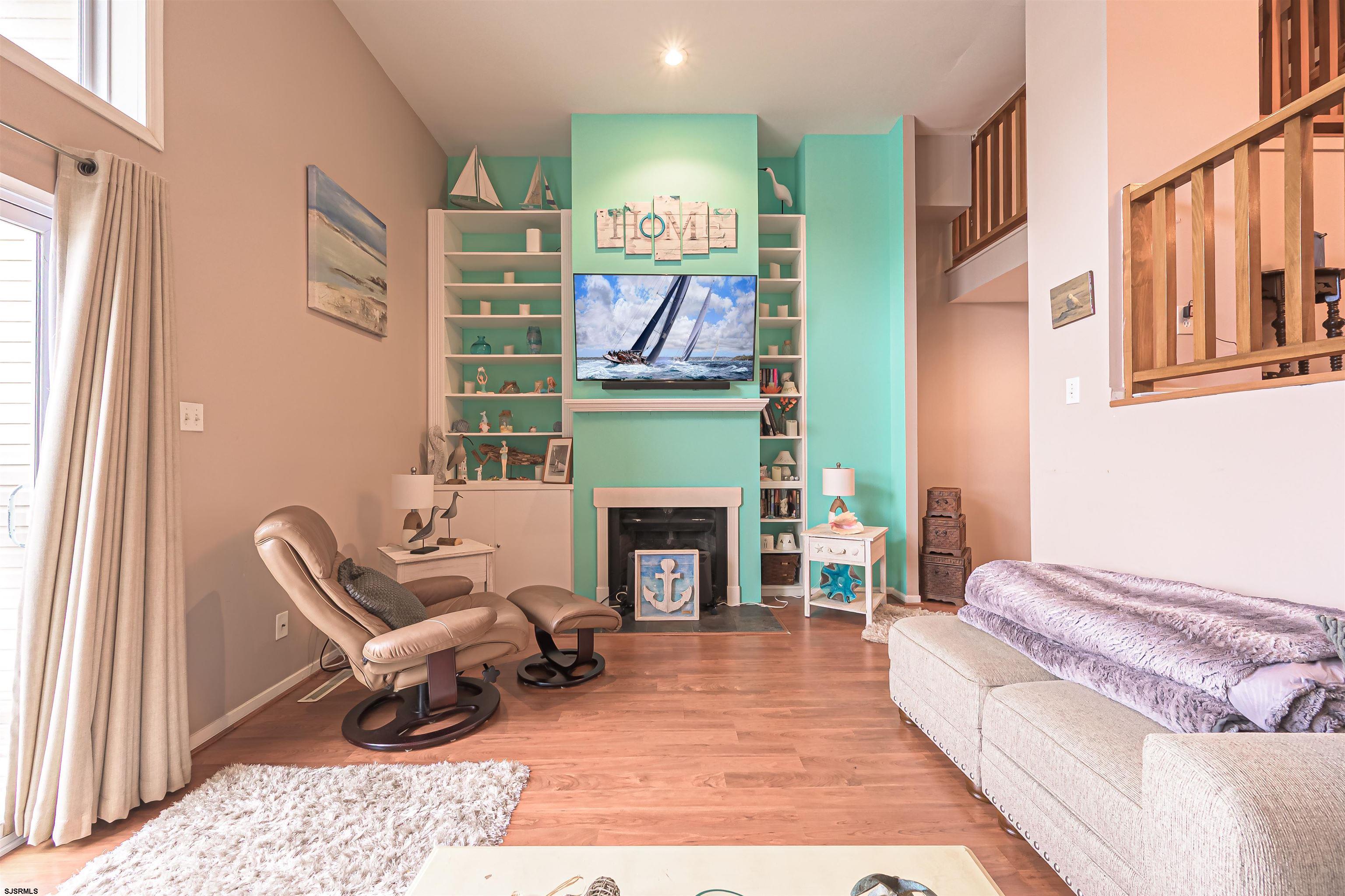 6 Marc Lane Brigantine, NJ 08203 - Photo 11 of 28 a living room with furniture fireplace and rug
