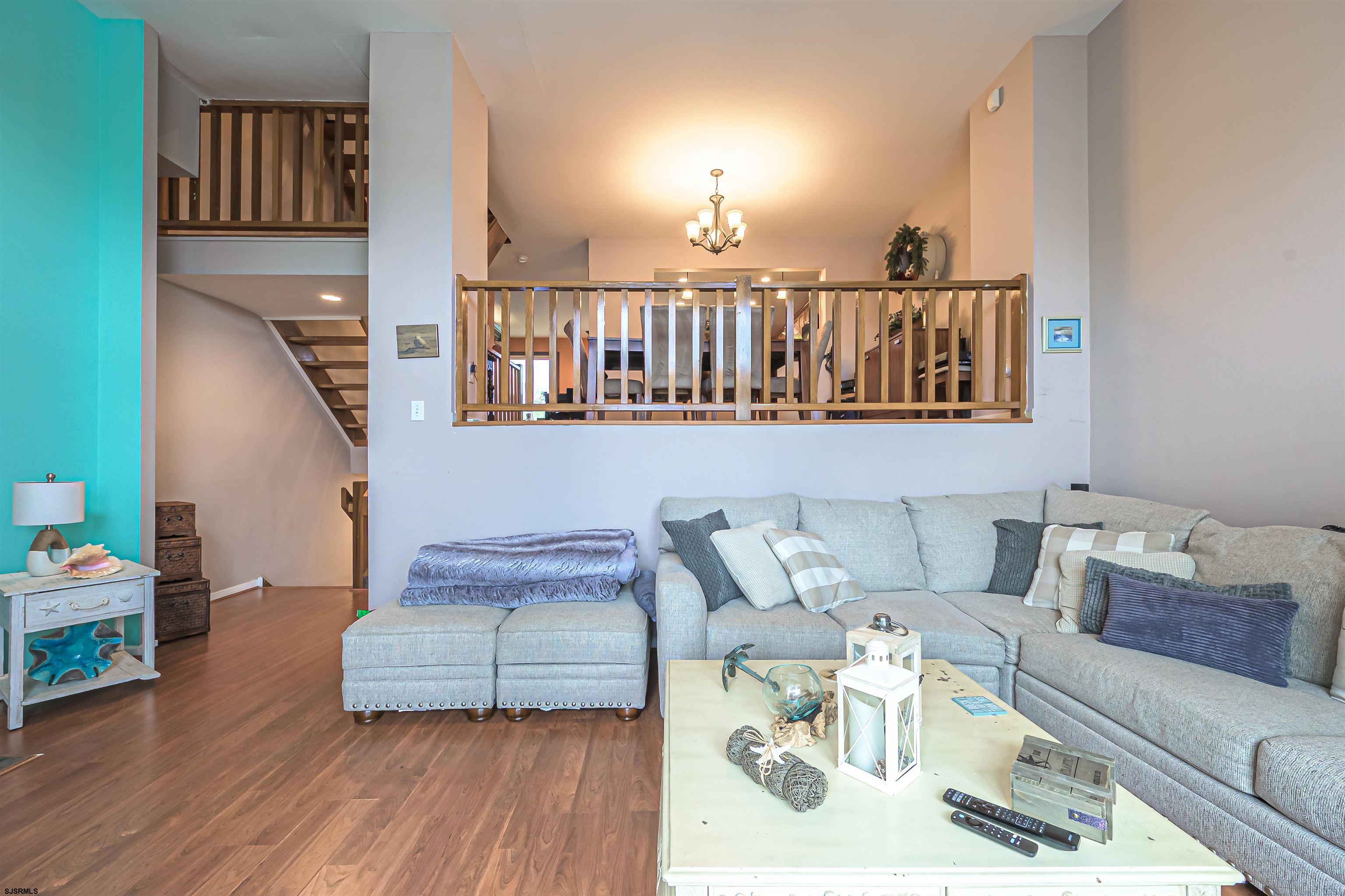 6 Marc Lane Brigantine, NJ 08203 - Photo 12 of 28 a living room with furniture and a wooden floor