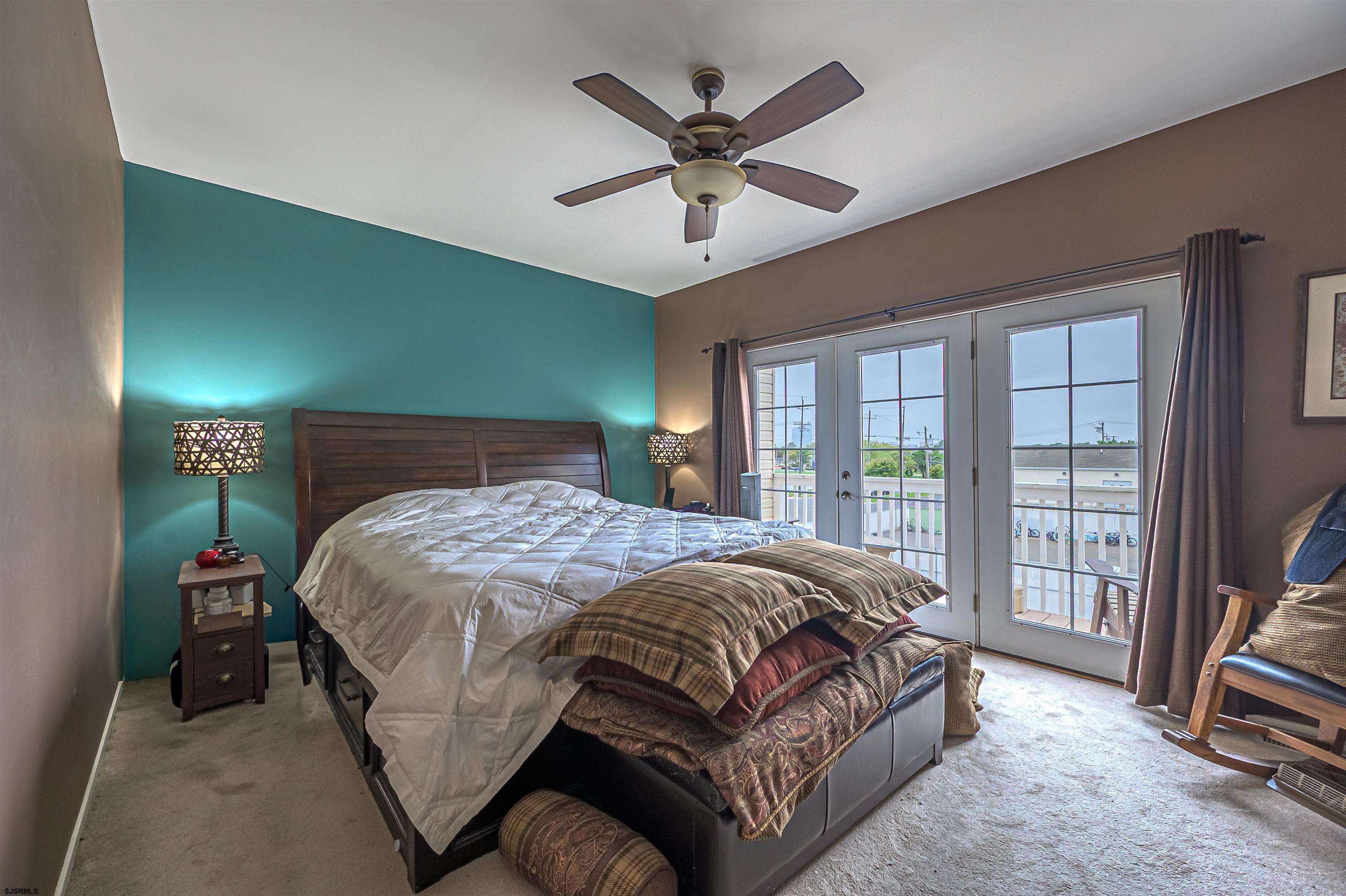 6 Marc Lane Brigantine, NJ 08203 - Photo 15 of 28 a bedroom with a bed and a large window