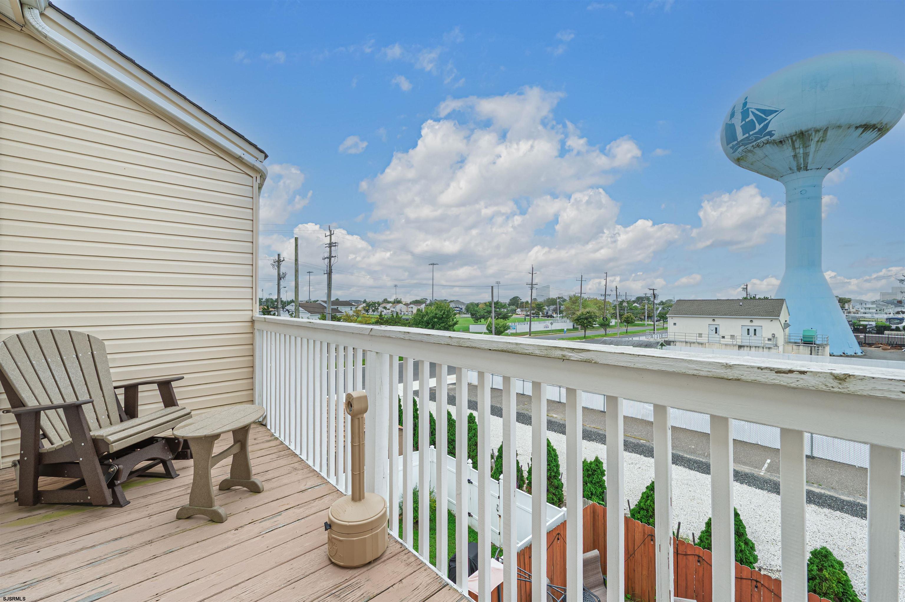 6 Marc Lane Brigantine, NJ 08203 - Photo 17 of 28 a view of a chairs and table on the deck