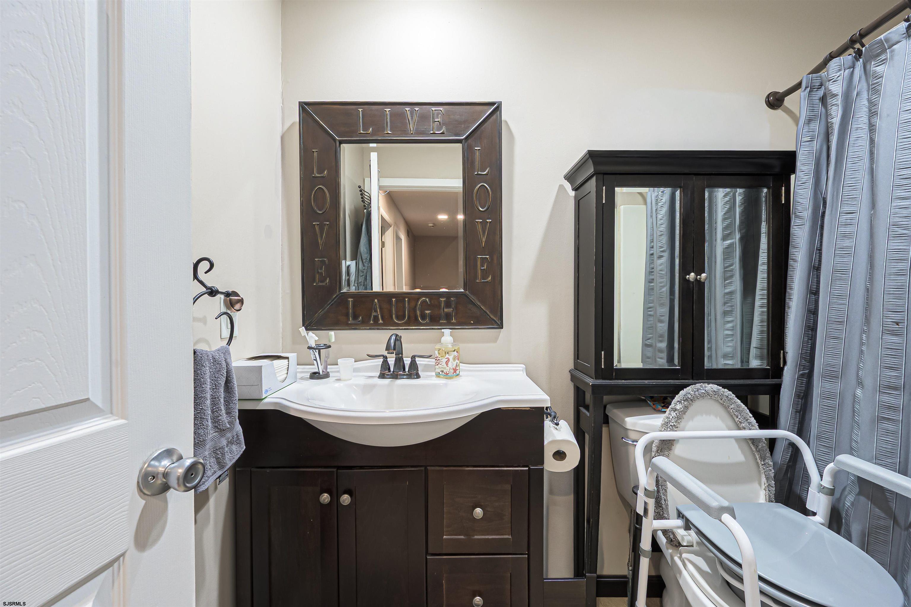 6 Marc Lane Brigantine, NJ 08203 - Photo 21 of 28 a bathroom with a double vanity sink and a mirror