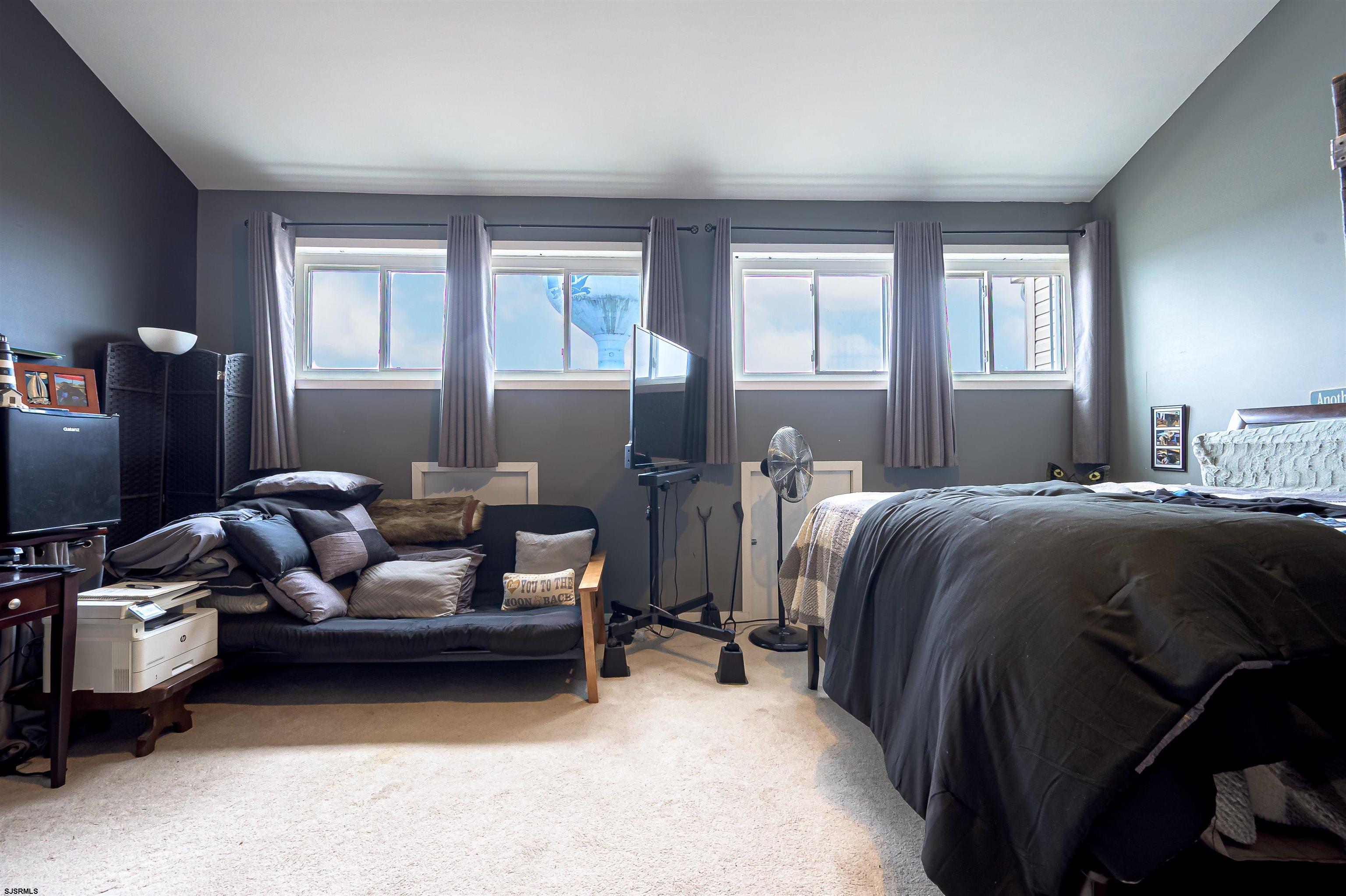 6 Marc Lane Brigantine, NJ 08203 - Photo 22 of 28 a bed room with bed and window