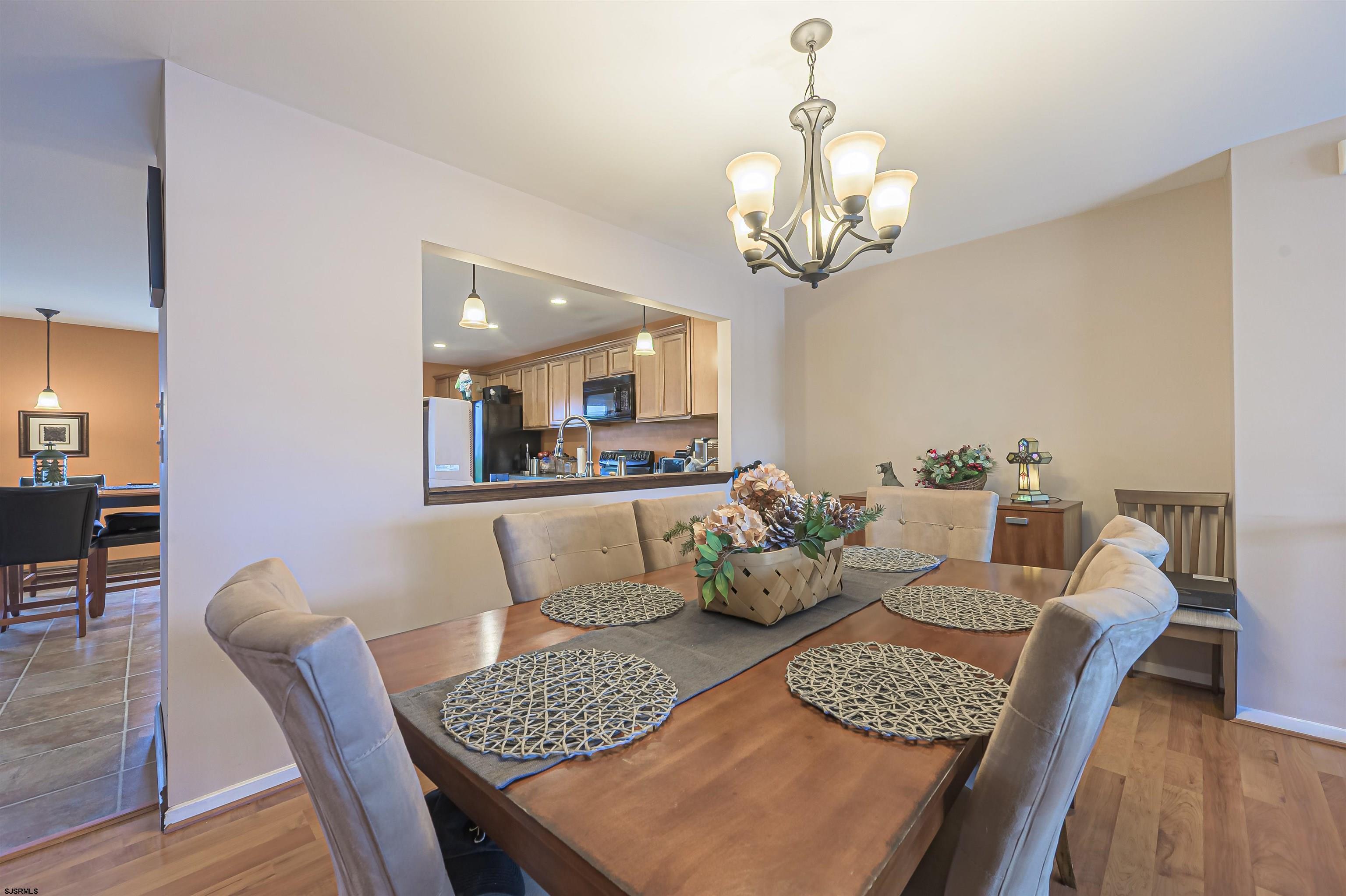 6 Marc Lane Brigantine, NJ 08203 - Photo 8 of 28 a dining room with furniture and wooden floor