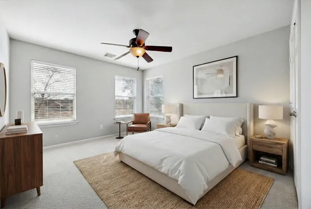 a view of a house with wooden fence