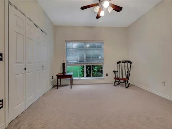 an empty room with furniture and windows