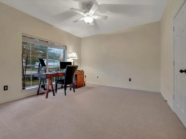 a view of dining room with furniture and chandelier