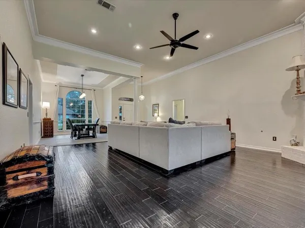 a living room with furniture and kitchen view