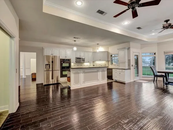a view of kitchen with furniture and wooden floor
