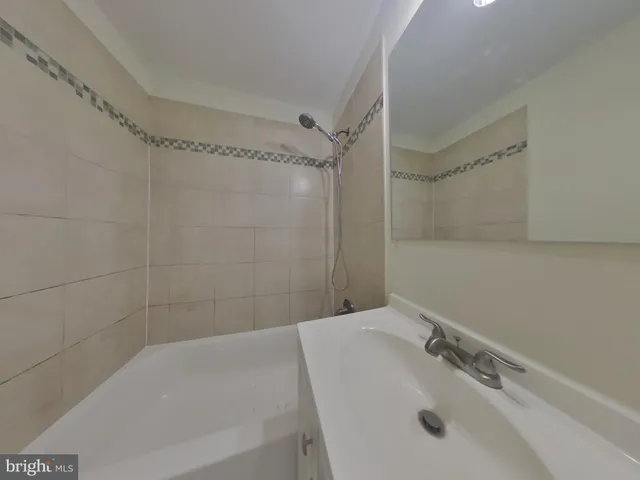 a bathroom with a sink and shower