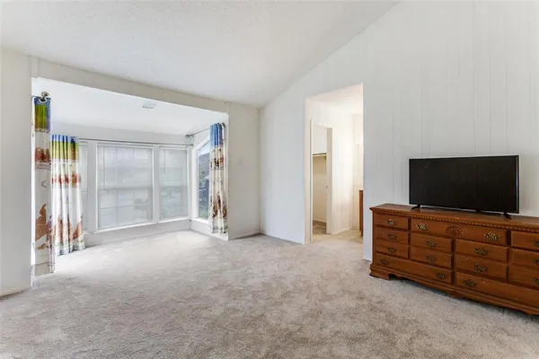 a room with a piano and wooden floor