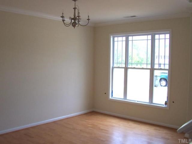 3241 Sunbright Lane Raleigh, NC 27610 - Photo 3 of 11 an empty room with a window