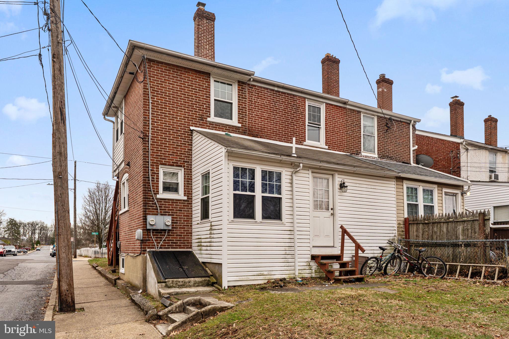 255 Noble Street, Unit B Souderton, PA 18964 - Photo 14 of 15 a front view of a house with a patio